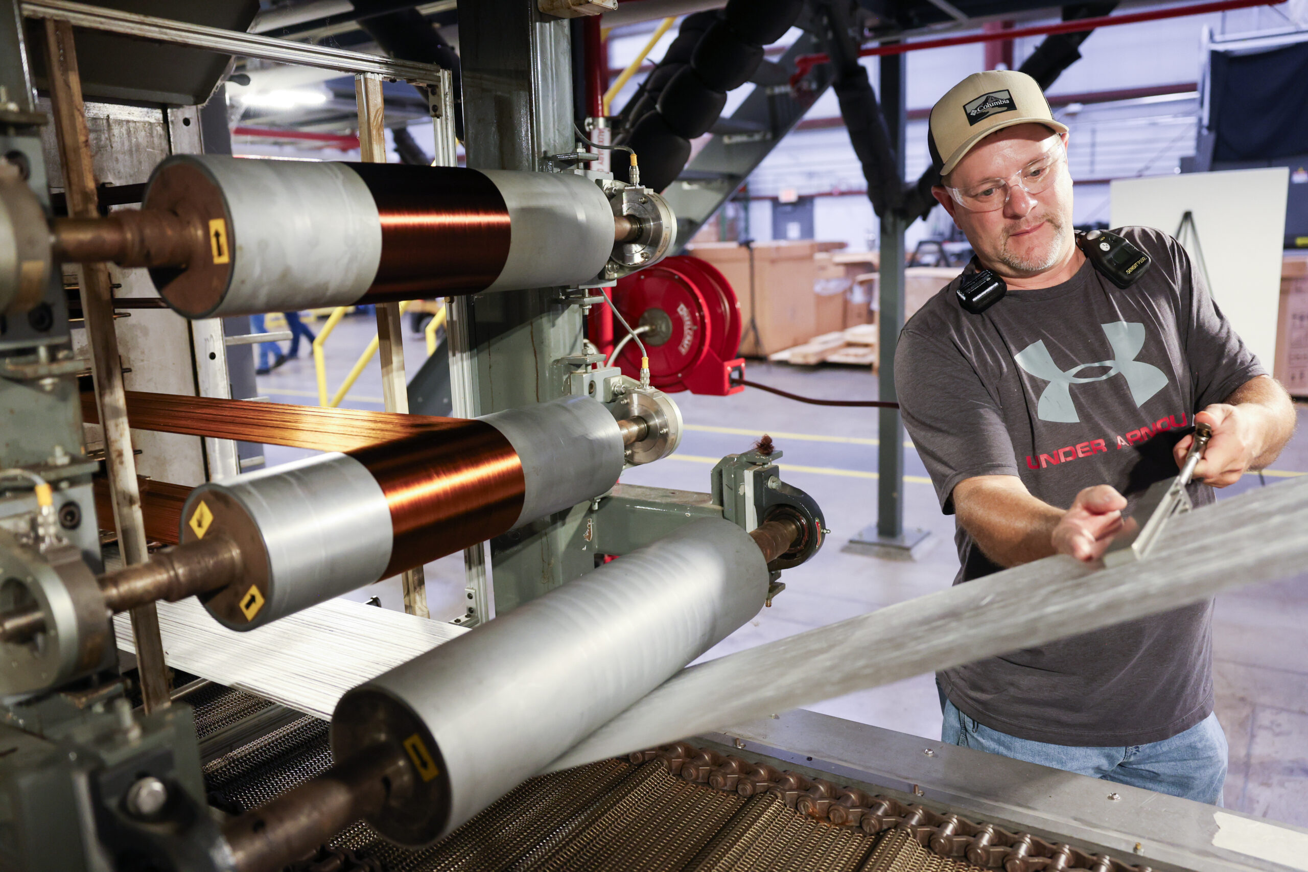Line technician Gary Vance uses an air splicer as part of the oxidation process on oven 1 at the Carbon Fiber Technology Facility (CFTF).